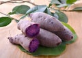 Boiled purple sweet yam on wooden background