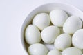Boiled quail eggs on a white plate  on white background Royalty Free Stock Photo
