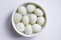 Boiled quail eggs on a white plate  on white background Royalty Free Stock Photo