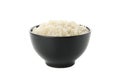 Boiled rice in black bowl isolated on background Royalty Free Stock Photo