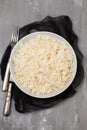 Boiled rice in a bowl on gray background. Royalty Free Stock Photo