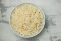 Boiled rice in a bowl on gray background. Royalty Free Stock Photo