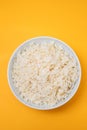 Boiled rice in a bowl on yellow paper Royalty Free Stock Photo