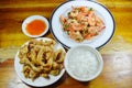 Boiled rice eat with fried chicken and spicy shrimp salad Royalty Free Stock Photo