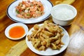 Boiled rice eat with fried chicken and spicy shrimp salad Royalty Free Stock Photo