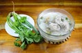 Boiled rice with pork bone hot soup and fresh vegetable Royalty Free Stock Photo