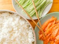 Boiled rice, salmon slices, cucumber slices and bamboo chopsticks Royalty Free Stock Photo