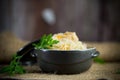 Boiled rice with vegetables and meat in a ceramic bowl on a wooden table Royalty Free Stock Photo