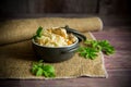 boiled rice with vegetables and meat in a ceramic bowl on a wooden table Royalty Free Stock Photo