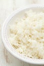 Boiled rice on white bowl on white background Royalty Free Stock Photo