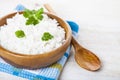 Boiled rice in a wooden bowl and spoon Royalty Free Stock Photo