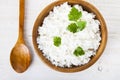 Boiled rice in a wooden bowl and spoon Royalty Free Stock Photo