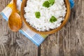 Boiled rice in a wooden bowl and spoon Royalty Free Stock Photo