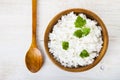 Boiled rice in a wooden bowl and spoon Royalty Free Stock Photo