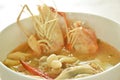 boiled river shrimp with chicken in Thai spicy herb soup or tom yum kung on bowl