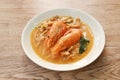 boiled river shrimp with herb in Thai spicy soup or tom yum kung on plate