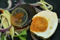 Boiled salty and black preserved egg half cut with slice ginger salad on plate Royalty Free Stock Photo