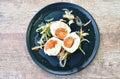 Boiled salty egg half cut with slice ginger salad on plate Royalty Free Stock Photo