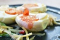 Boiled salty egg half cut with slice ginger salad on plate Royalty Free Stock Photo