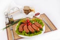 Boiled sausages with tomatoes, cucumbers and greens. Served with black or white bread.