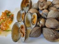 Boiled scallops paired with seafood sauce on a white plate Healthy seafood ideas.