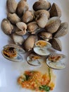 Boiled scallops paired with seafood sauce on a white plate Healthy seafood ideas.