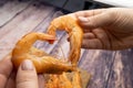 Boiled shrimp on the background of a wooden table form the shape of a heart and lean against each other Royalty Free Stock Photo