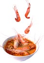 Boiled shrimp falling in Thai spicy soup or tom yum kung on bowl