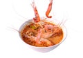 Boiled shrimp falling in Thai spicy soup or tom yum kung on bowl