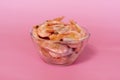 boiled shrimp in a glass bowl on a pink background Royalty Free Stock Photo