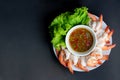 Boiled shrimp with spicy sauce on the white plate Royalty Free Stock Photo