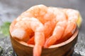 Boiled shrimps prawns on ice frozen at the seafood restaurant fresh shrimp on wooden bowl with ingredients for cooking seafood Royalty Free Stock Photo