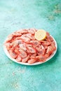 Boiled shrimps prawns with lemon on a plate Royalty Free Stock Photo