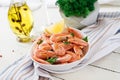 Boiled shrimps or prawns on a white bowl on a white table. Royalty Free Stock Photo