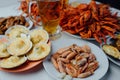 Boiled shrimps, scallops with cheese, boiled crayfish and beer