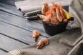 Boiled shrimps served with lemon in a small bowl over rustic wooden background with cloth Royalty Free Stock Photo