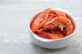 Boiled shrimps in white bowl on ceramic background Royalty Free Stock Photo