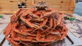 Boiled snow crabs are piled up on a tray.