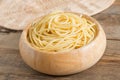 Boiled spaghetti in wood bowl. Royalty Free Stock Photo