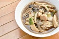 Boiled spicy mixed mushroom and gourd soup on bowl