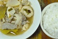 Boiled spicy pork entrails in Tom Yum soup on bowl eat couple with rice