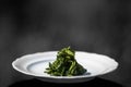 Boiled spinach on white dish. Boiled greens, or Horta vrasta, are a staple in any Greek household. Vlita the local green leafy Royalty Free Stock Photo