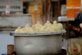 Traditional morning street food in China, using coal fire for heating soup. Royalty Free Stock Photo