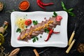 Boiled veal tongue with vegetables and spices on a plate. Restaurant dishes. Top view. Royalty Free Stock Photo