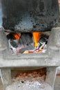 Boiled water in a black stainless steel pot on a stove