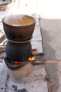 Boiled water in a stainless steel pot on a stove