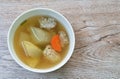 Boiled winter melon with chop chicken  and slice carrot soup in bowl on table Royalty Free Stock Photo