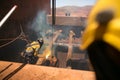 Boilermaker abseiler wearing safety harness, helmet commencing oxygen lancing