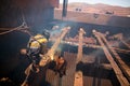 Boilermaker abseiler wearing safety harness, helmet commencing oxygen lancing