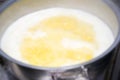 Boiling butter in a saucepan on a gas stove Royalty Free Stock Photo